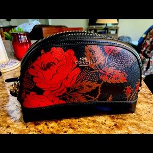 Coach crossbody bag. Black with red floral and leaves.